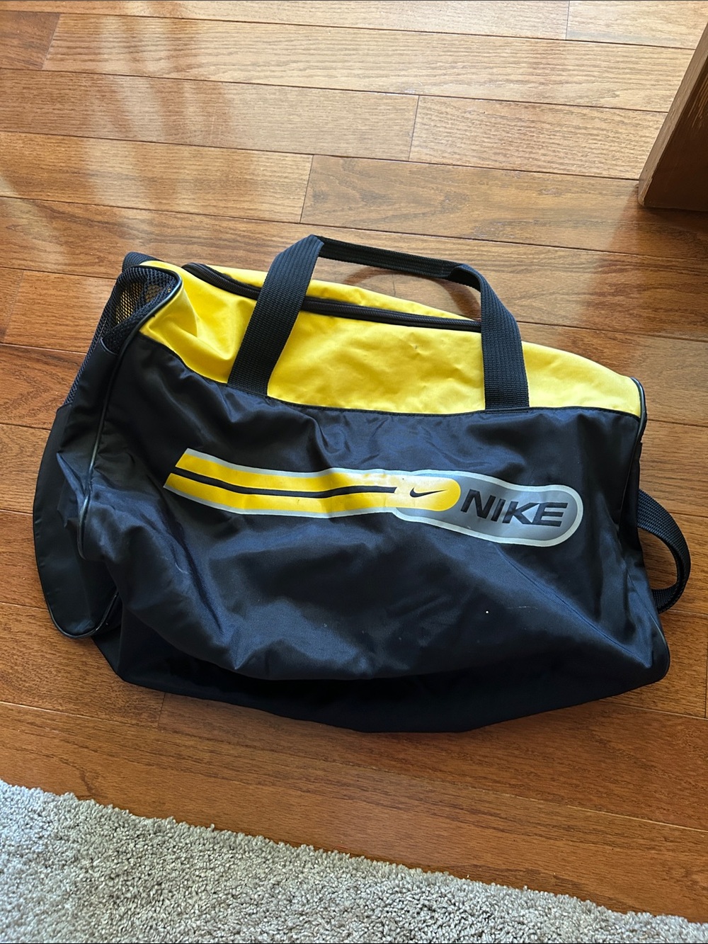 Vintage Nike Black and Yellow Duffel Bag with Logo Stripe